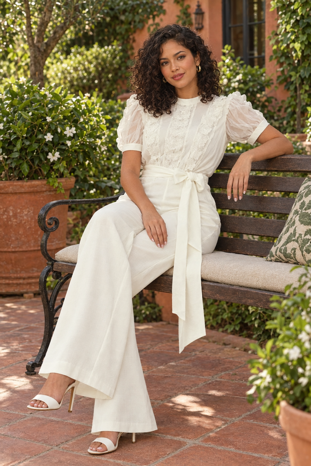 Latina model seated in a garden café