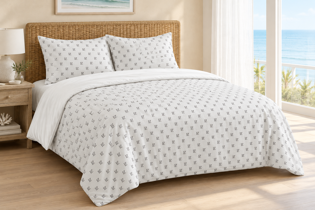 Monogram bedding set in an airy coastal bedroom