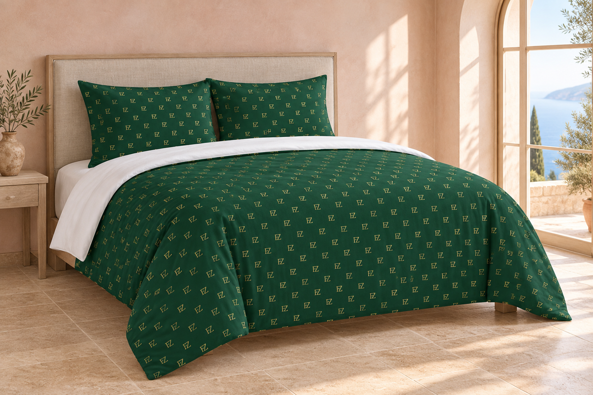 Forest-green monogram bedding in a blush Mediterranean bedroom