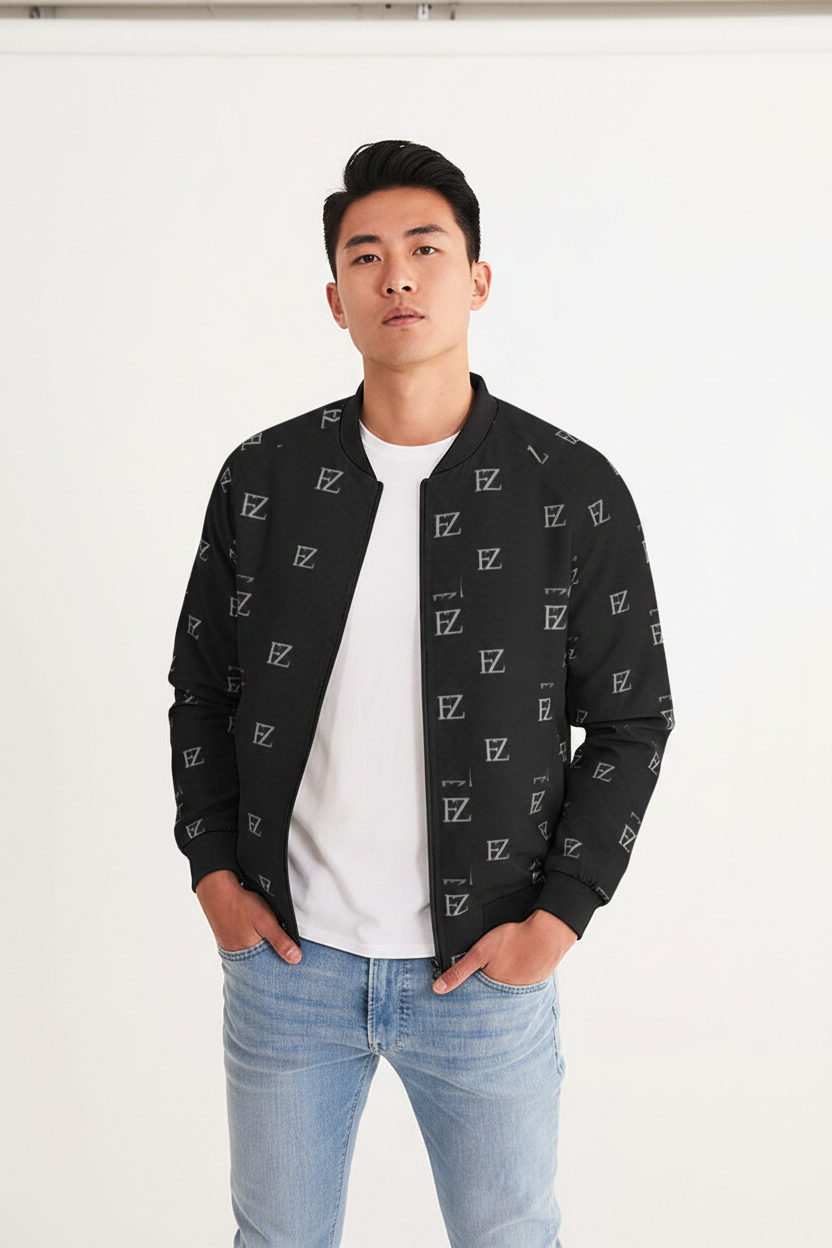 Asian male model wearing FZ black monogram bomber jacket, minimalist studio background