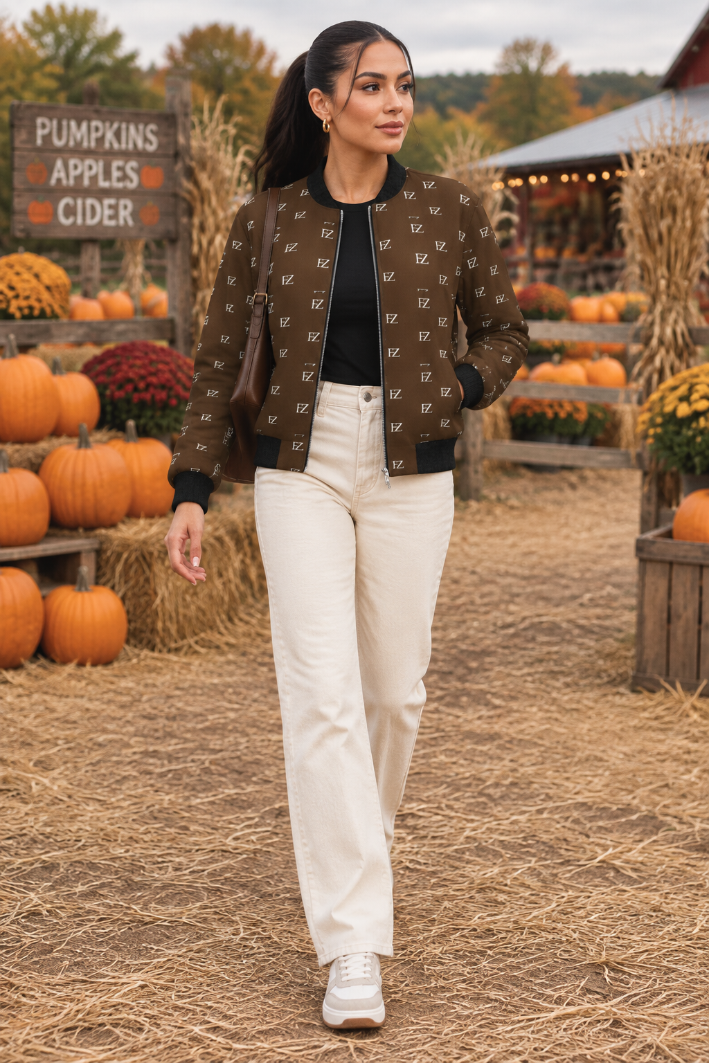 Latina woman in the women's brown FZ bomber at a pumpkin patch