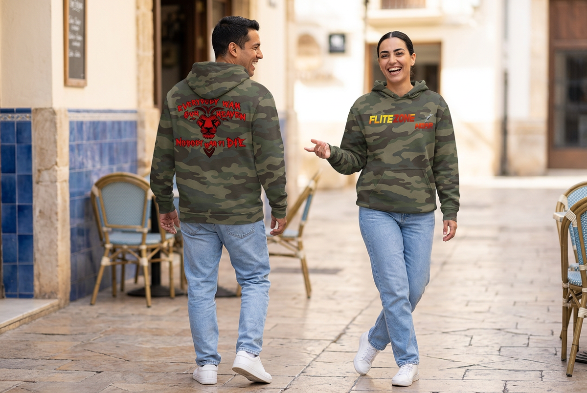Middle Eastern woman showing the olive-camo hoodie front and Latino man showing the back in a playful café scene