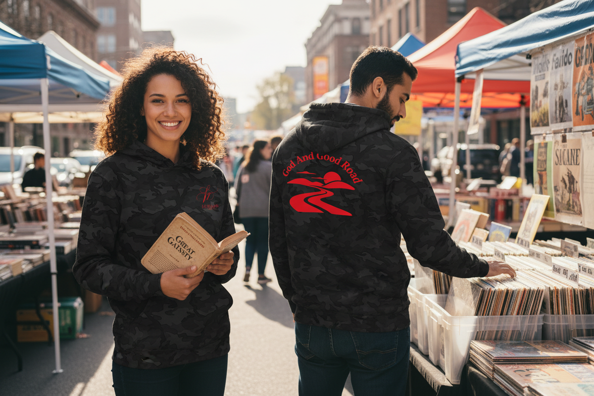 Two friends at an outdoor book and record fair with the hoodie front and back clearly visible